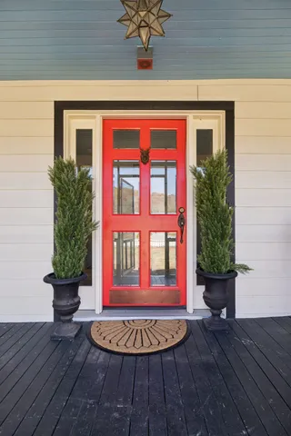 a view of a house with swimming pool and a yard