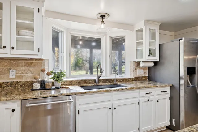 a view of a livingroom with furniture and window