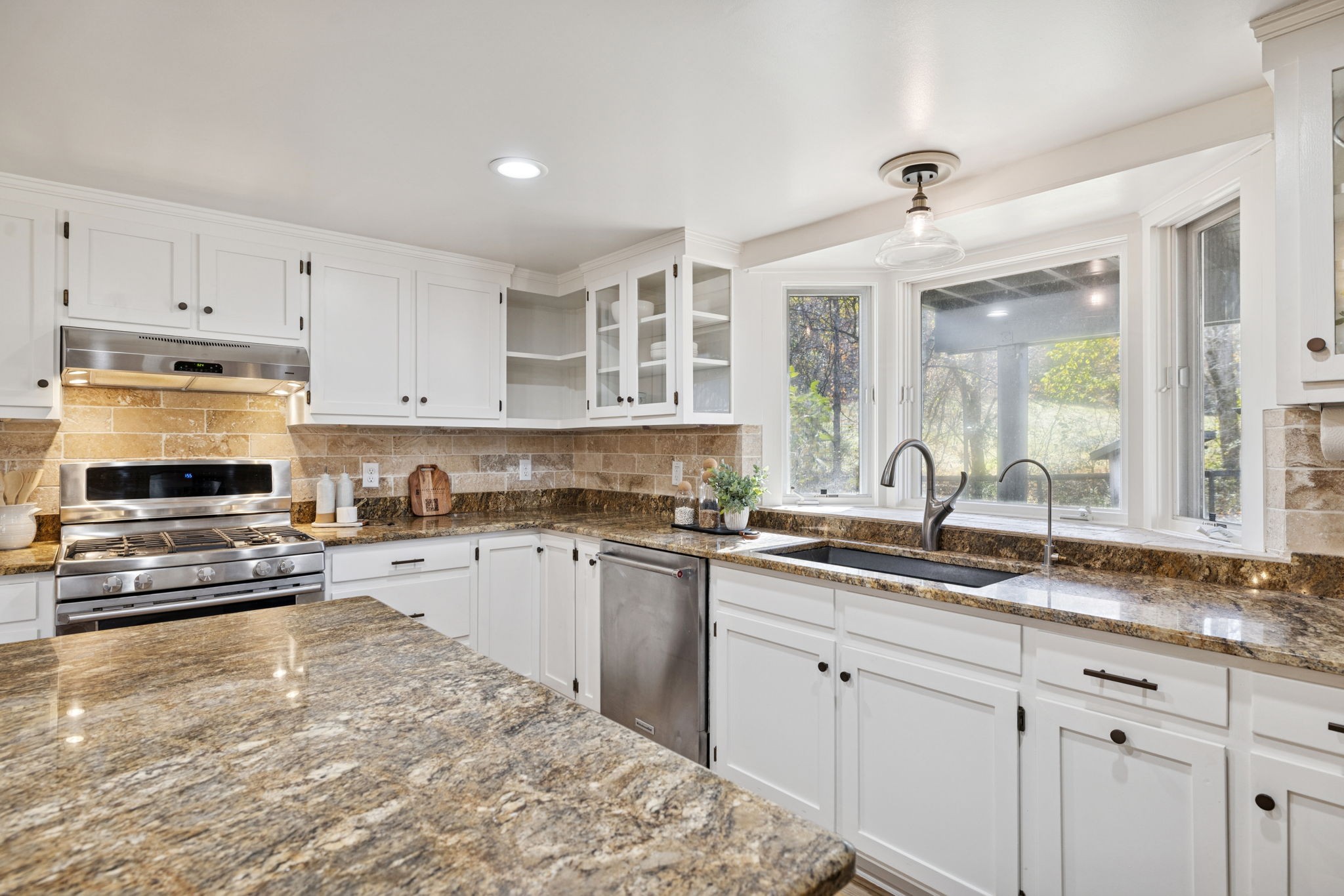 5467 Pinewood Road Franklin, TN 37064 - Photo 34 of 98 a kitchen with kitchen island granite countertop a sink cabinets and stainless steel appliances