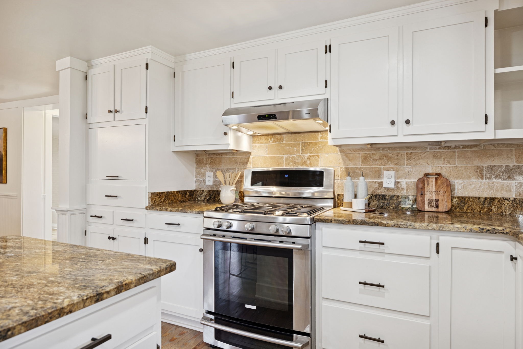 5467 Pinewood Road Franklin, TN 37064 - Photo 36 of 98 a kitchen with granite countertop a stove sink and cabinets