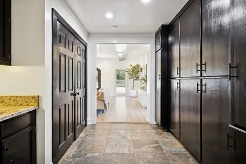 a view of a room with shelf on the wall