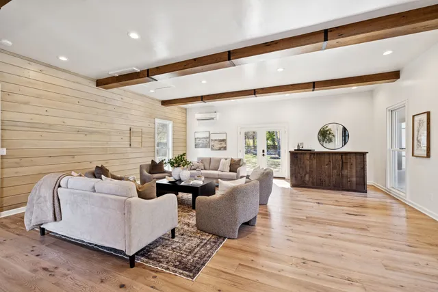 a view of a room with wooden floor