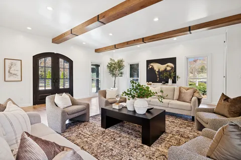 a view of a house with a yard and plants