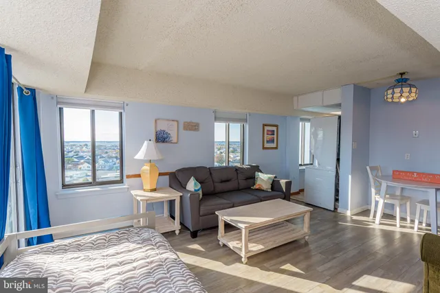 a view of a room that has a bed in it