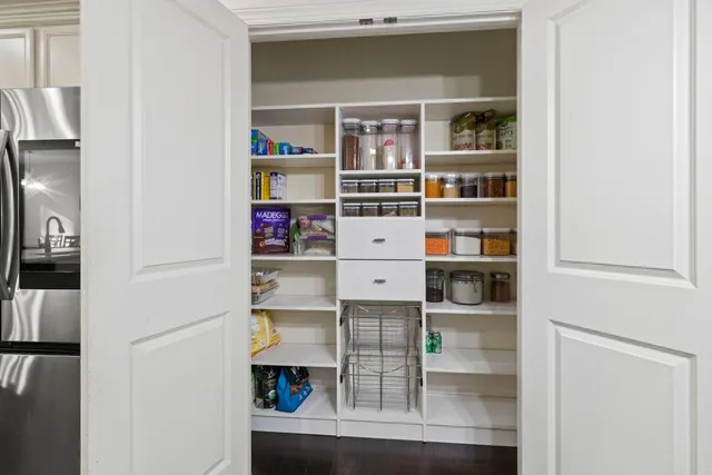 a shelf with books and knick knacks on it