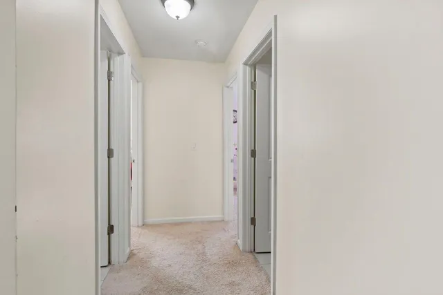 a view of hallway with closet