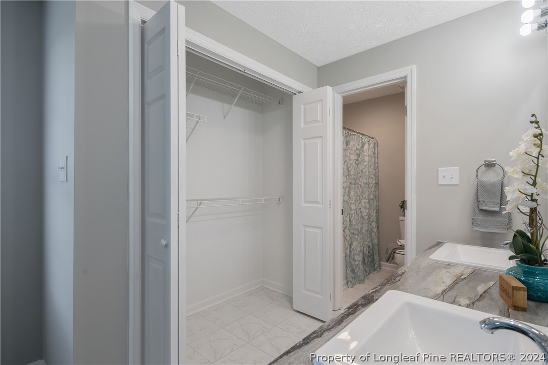 130 Rye Lane Raeford, NC 28376 - Photo 21 of 38 a bathroom with a sink and shower