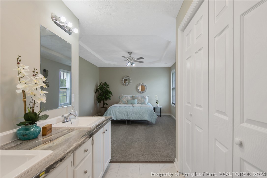 130 Rye Lane Raeford, NC 28376 - Photo 23 of 38 a living room with furniture and a chandelier