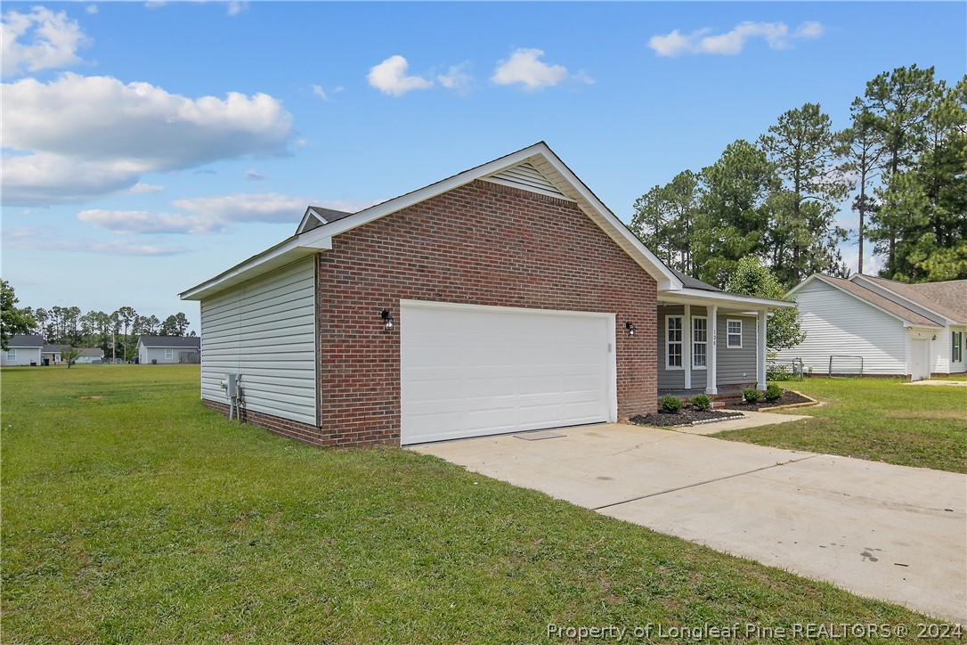 130 Rye Lane Raeford, NC 28376 - Photo 3 of 38 a front view of house with yard and trees