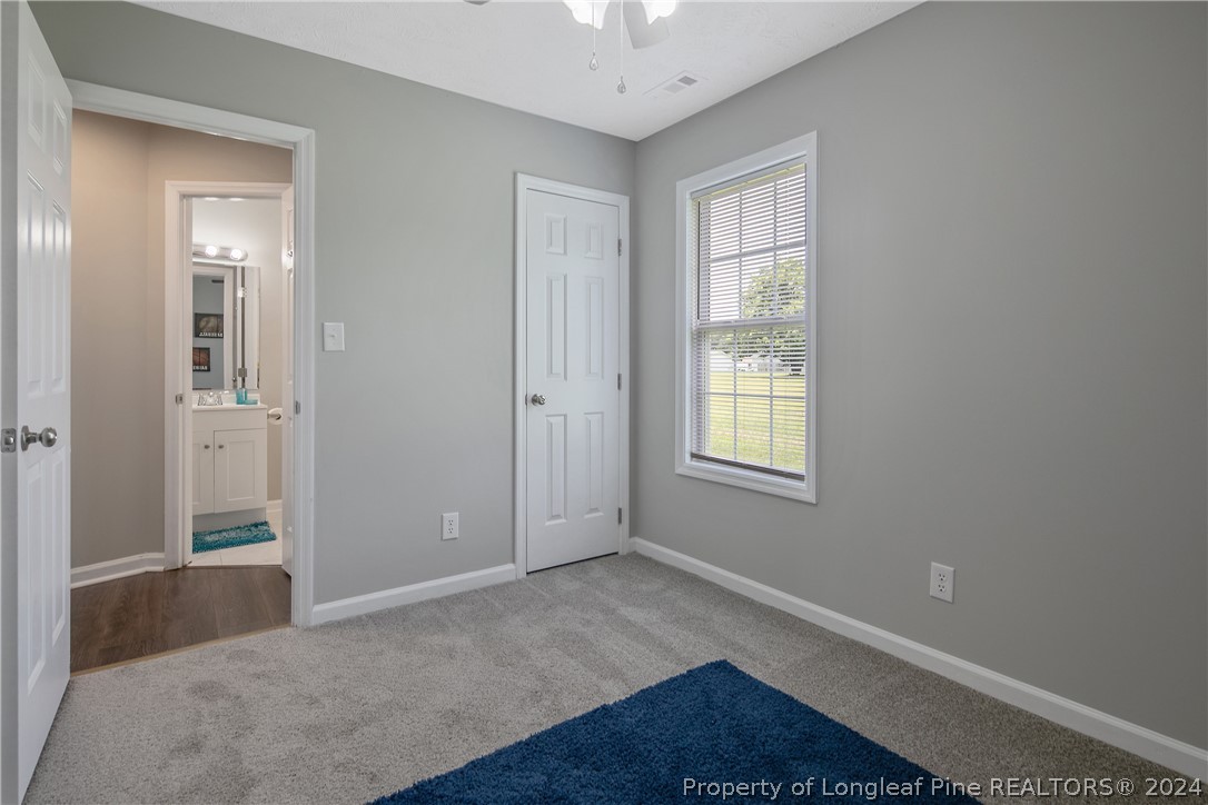 130 Rye Lane Raeford, NC 28376 - Photo 34 of 38 an empty room with windows and closet