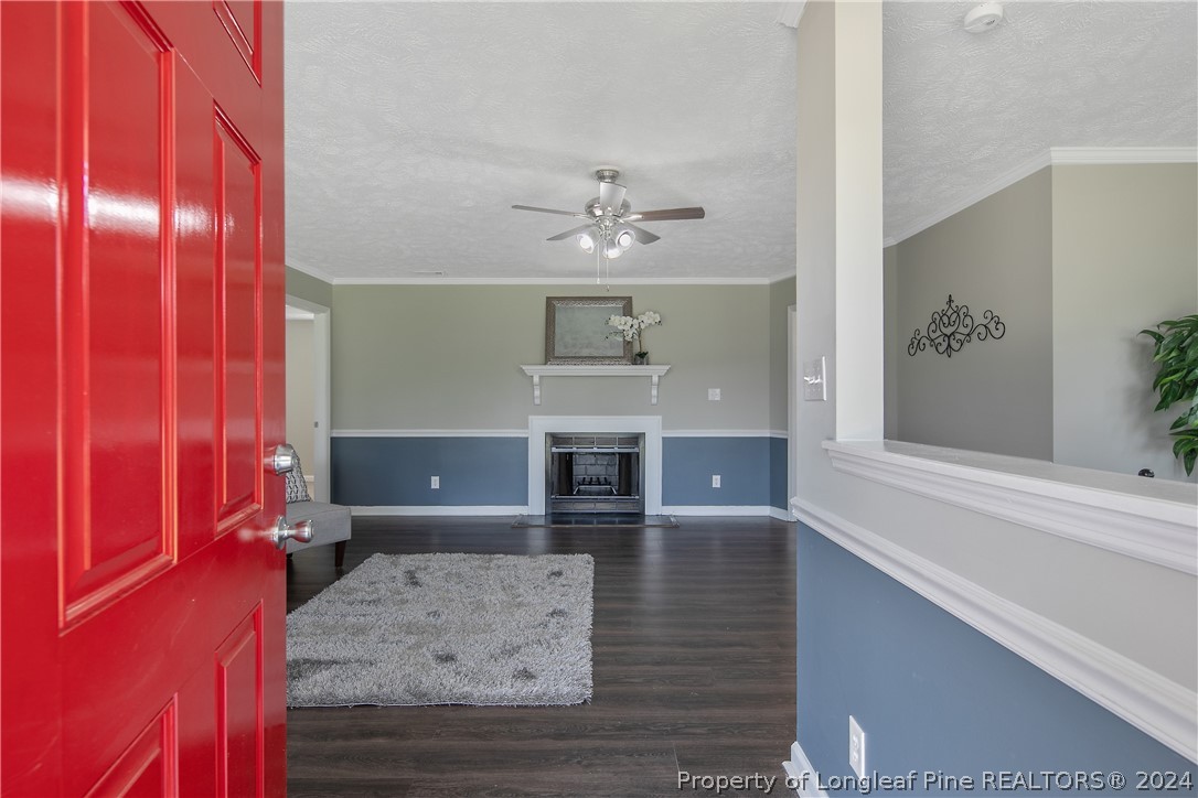 130 Rye Lane Raeford, NC 28376 - Photo 5 of 38 a view of a living room a fireplace with window