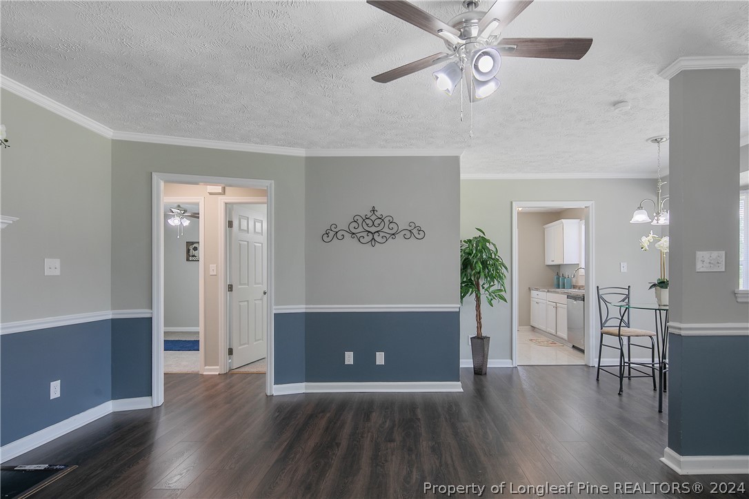 130 Rye Lane Raeford, NC 28376 - Photo 8 of 38 a view of a livingroom with a furniture hardwood floor and a ceiling fan