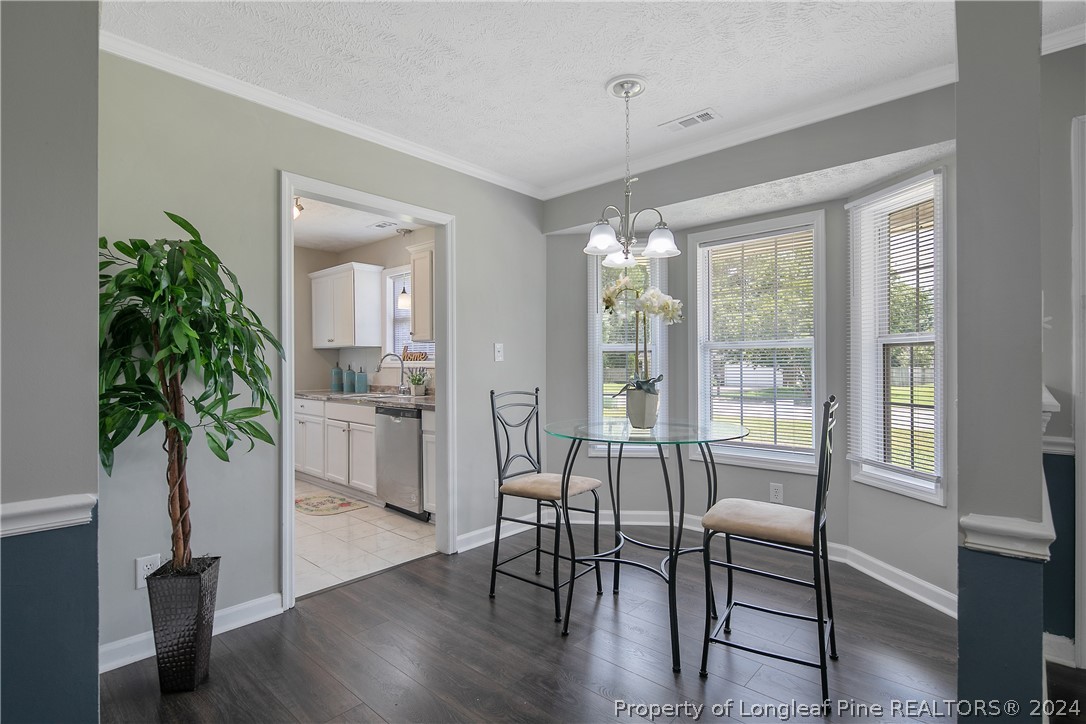 130 Rye Lane Raeford, NC 28376 - Photo 9 of 38 a view of a dining room with furniture window and wooden floor