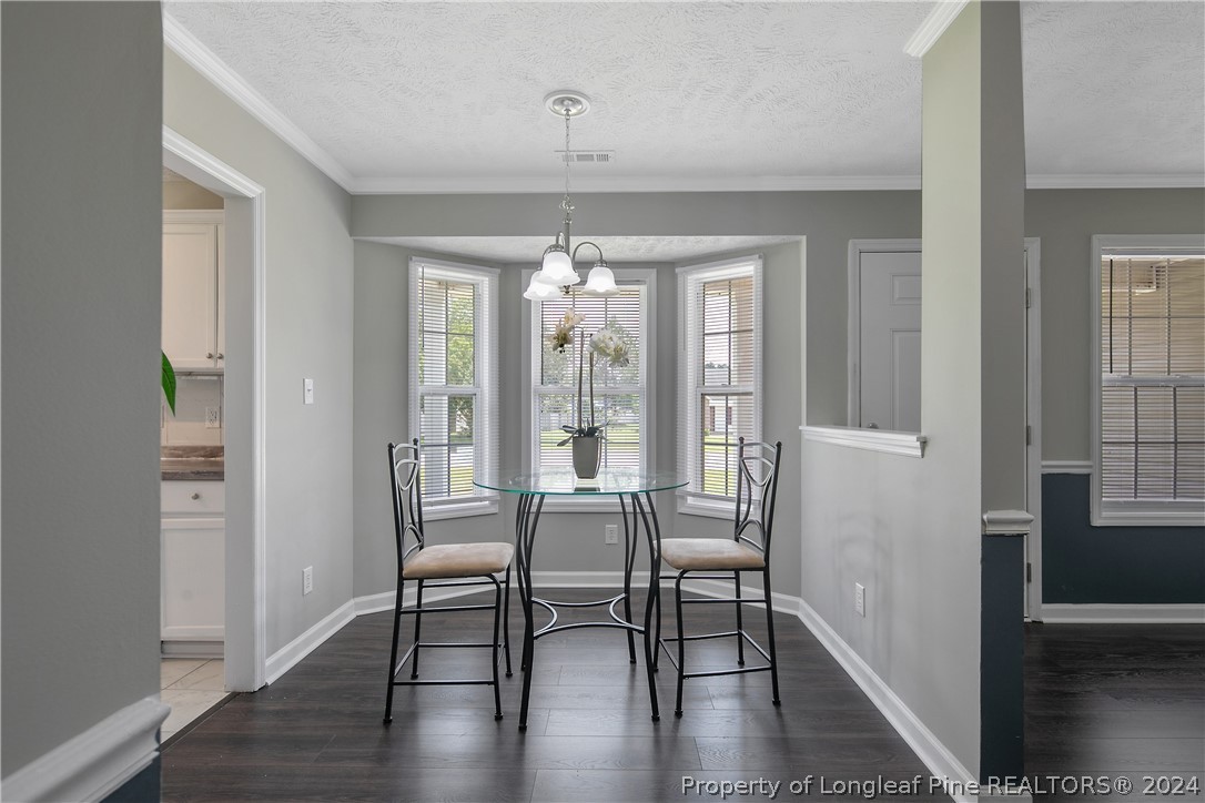 130 Rye Lane Raeford, NC 28376 - Photo 10 of 38 a view of a room with furniture window and wooden floor