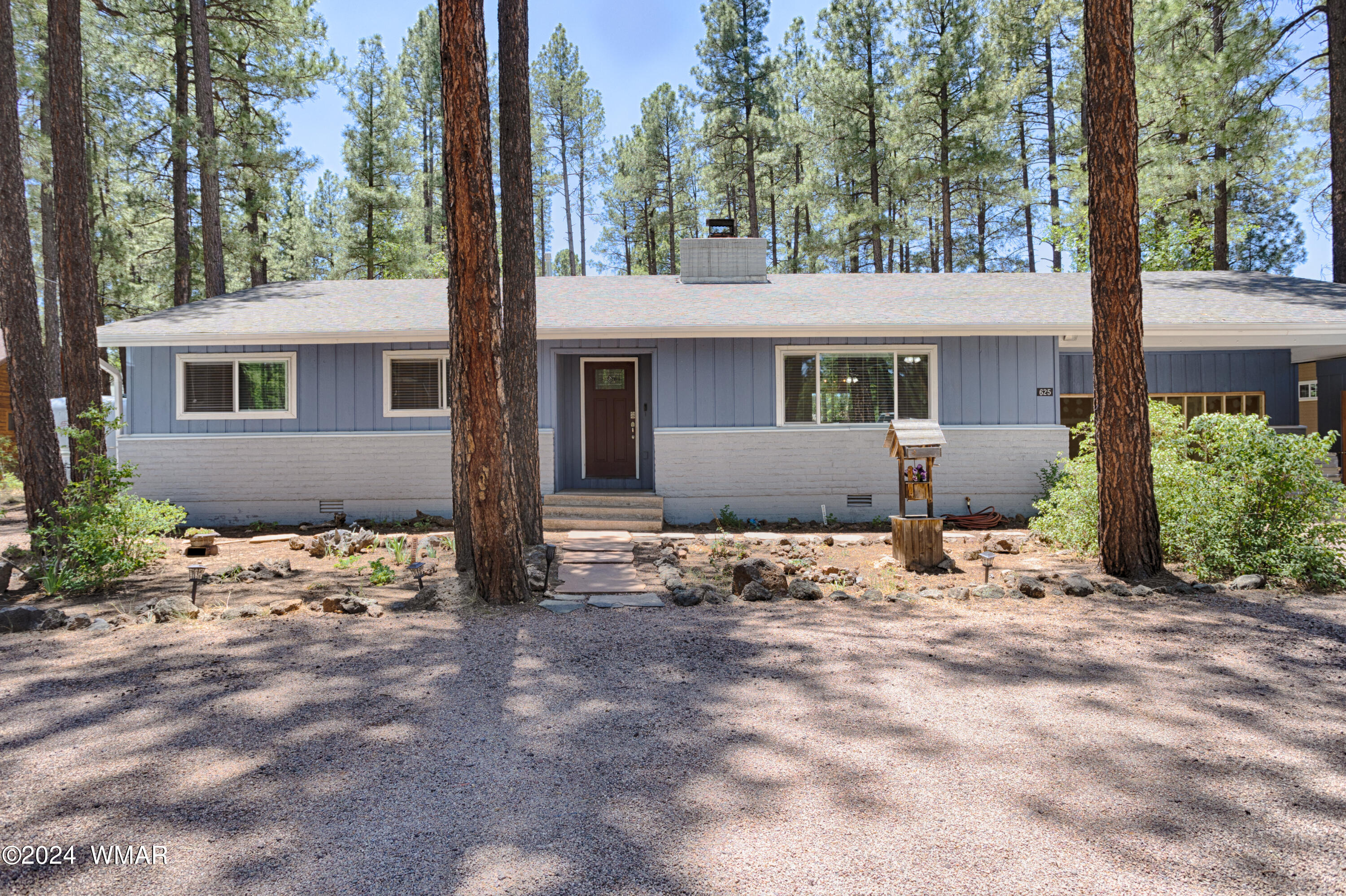 625 East Nora Place Pinetop, AZ 85935 - Photo 1 of 35 a view of a house with snow on the road