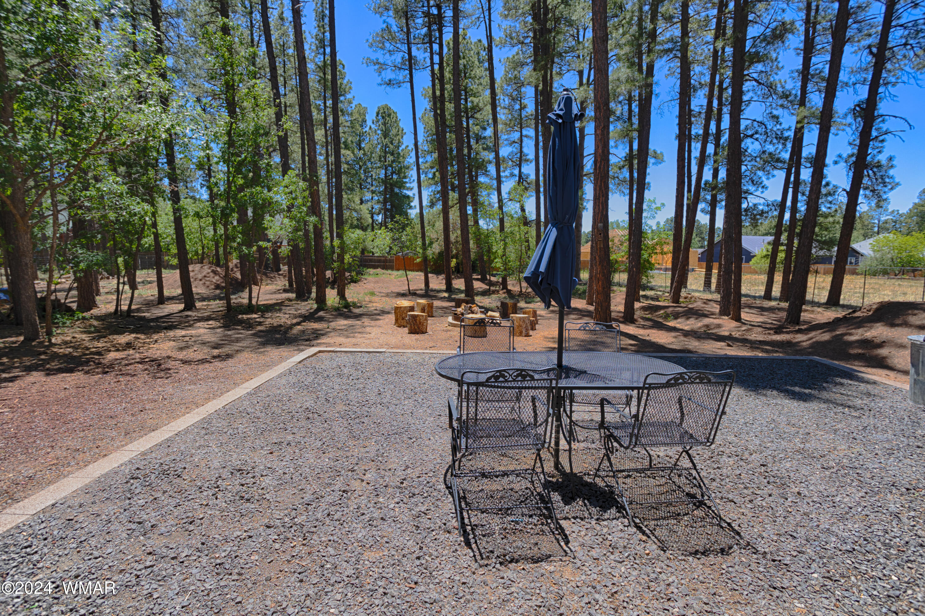 625 East Nora Place Pinetop, AZ 85935 - Photo 13 of 35 a view of a backyard with chairs