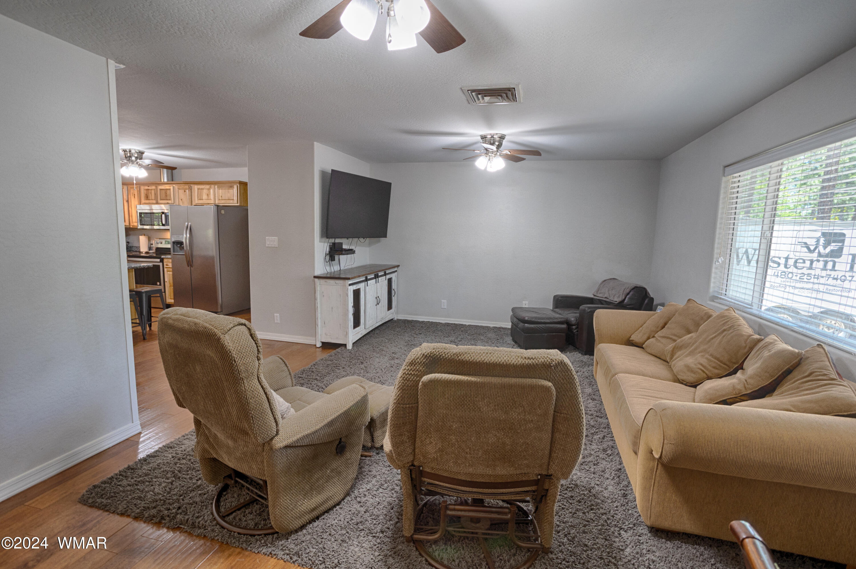 625 East Nora Place Pinetop, AZ 85935 - Photo 18 of 35 a living room with furniture a ceiling fan and a window