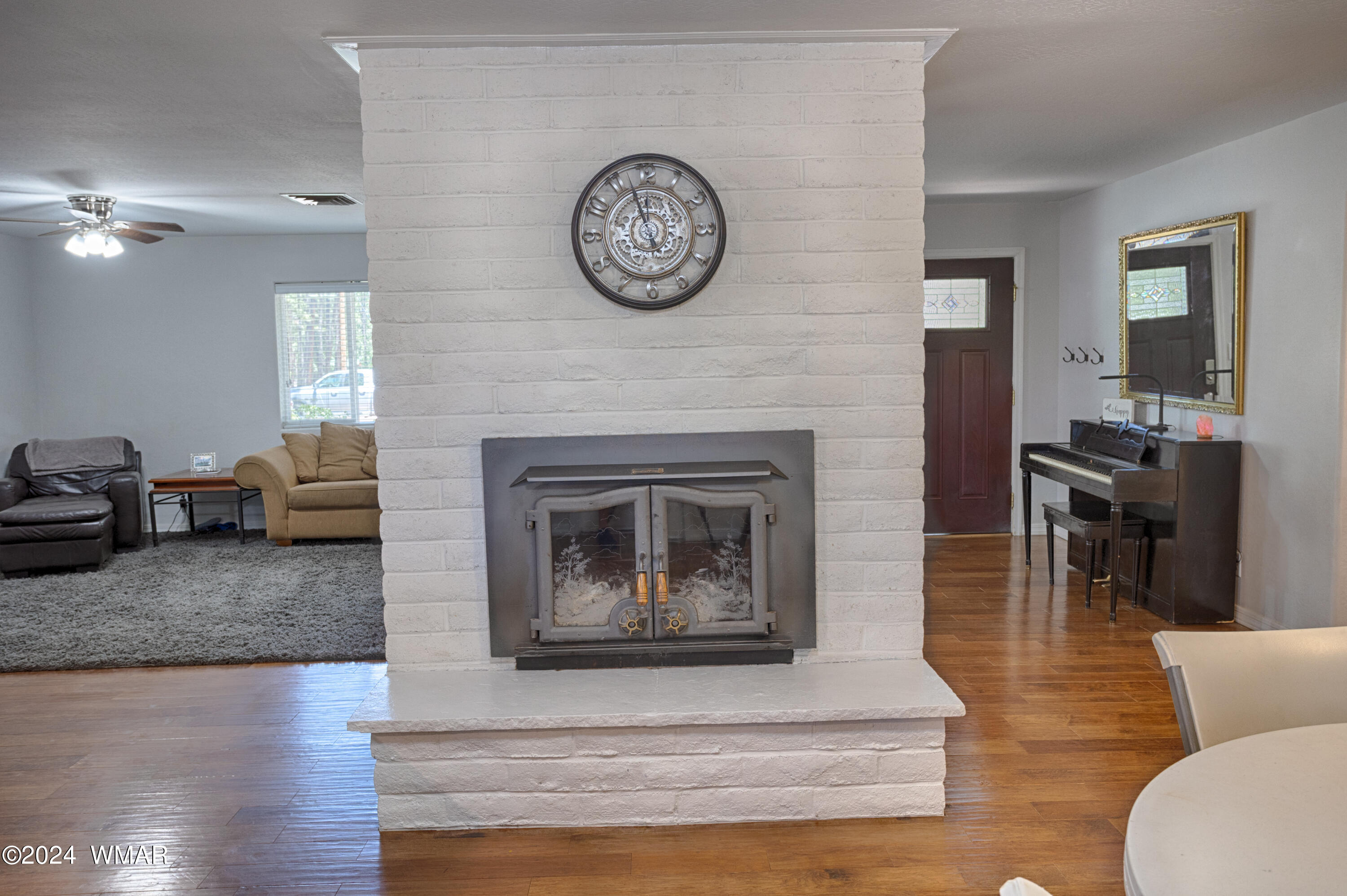 625 East Nora Place Pinetop, AZ 85935 - Photo 21 of 35 a living room with furniture and a fireplace