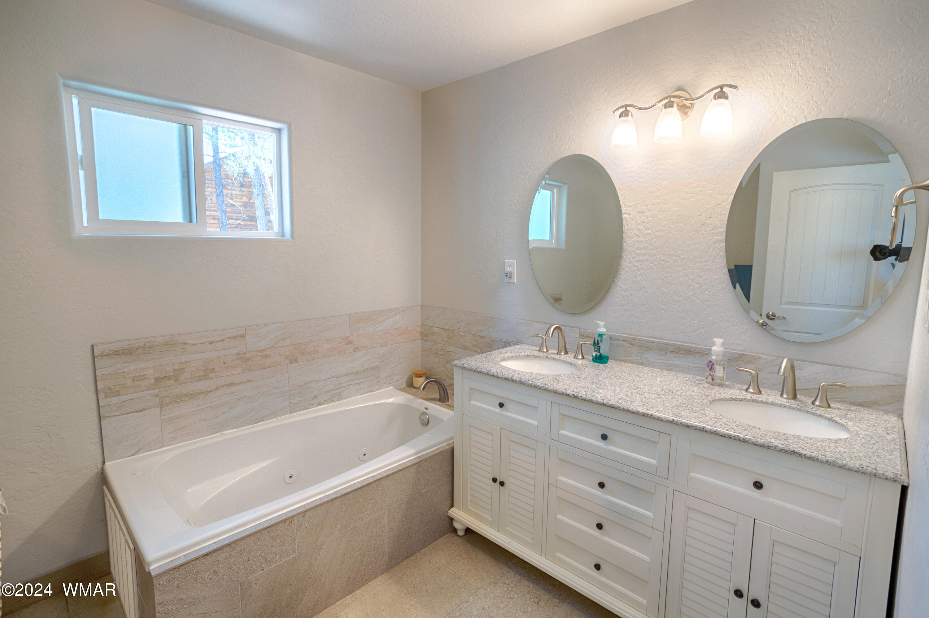 625 East Nora Place Pinetop, AZ 85935 - Photo 25 of 35 a bathroom with a double vanity sink and a mirror