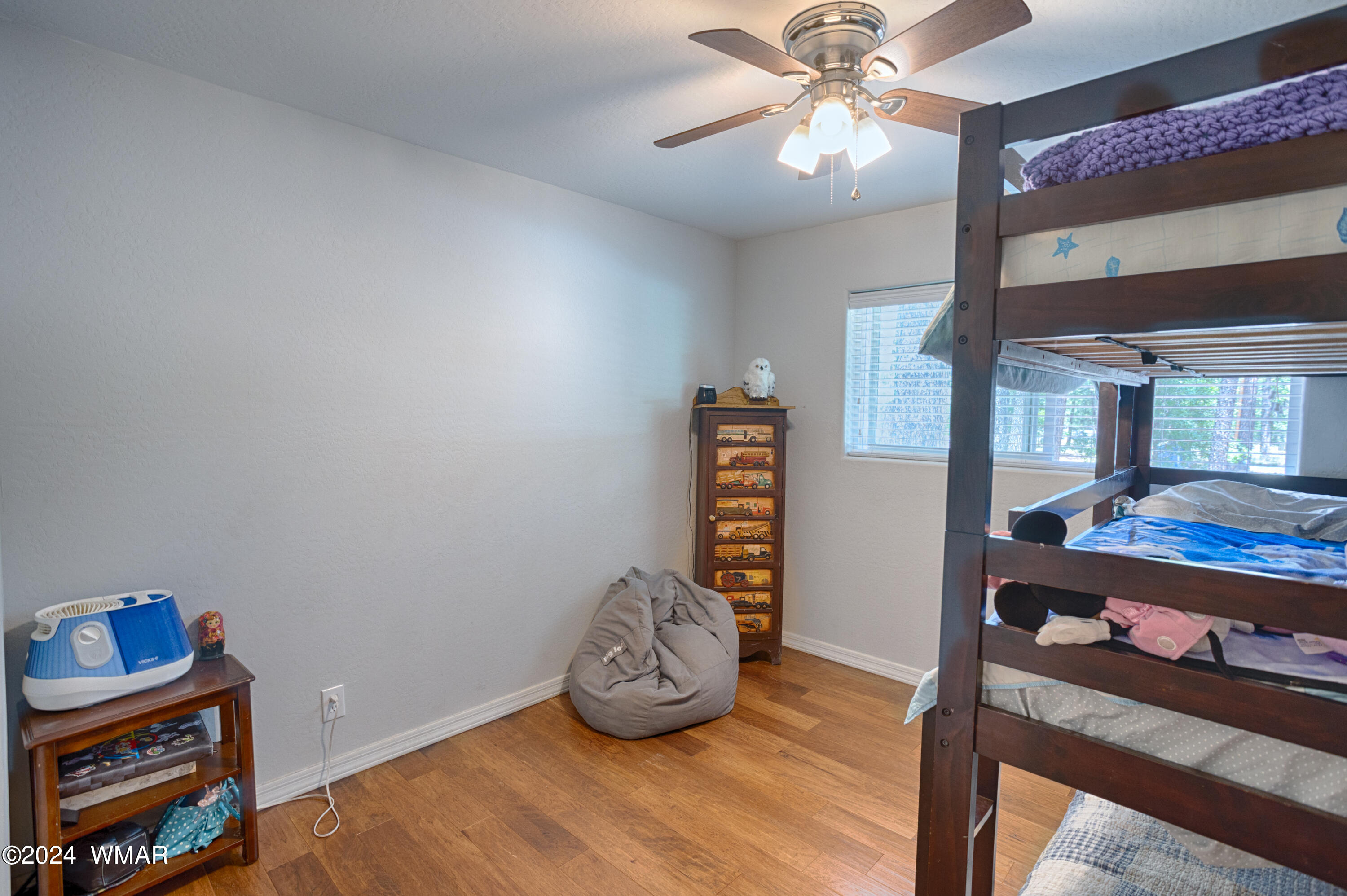 625 East Nora Place Pinetop, AZ 85935 - Photo 27 of 35 a living room with furniture and a wooden floor