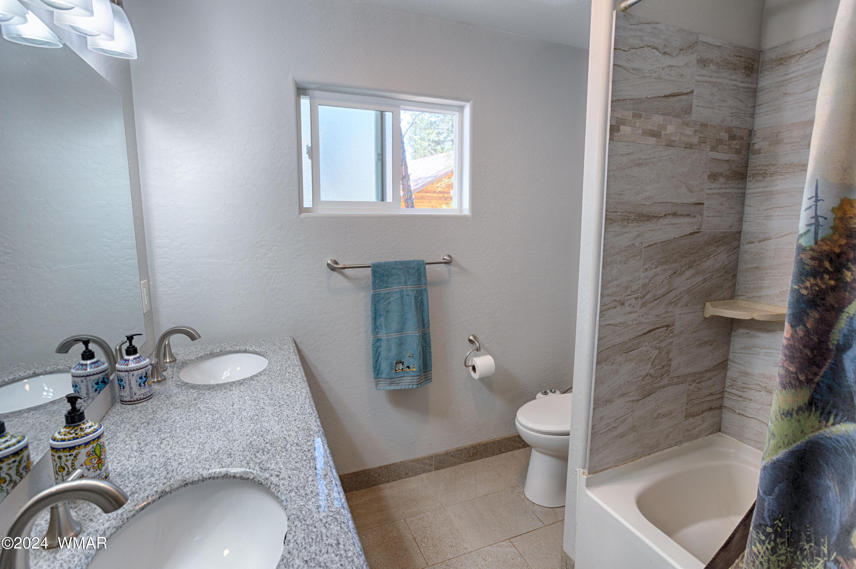 625 East Nora Place Pinetop, AZ 85935 - Photo 29 of 35 a bathroom with a granite countertop sink a toilet and shower