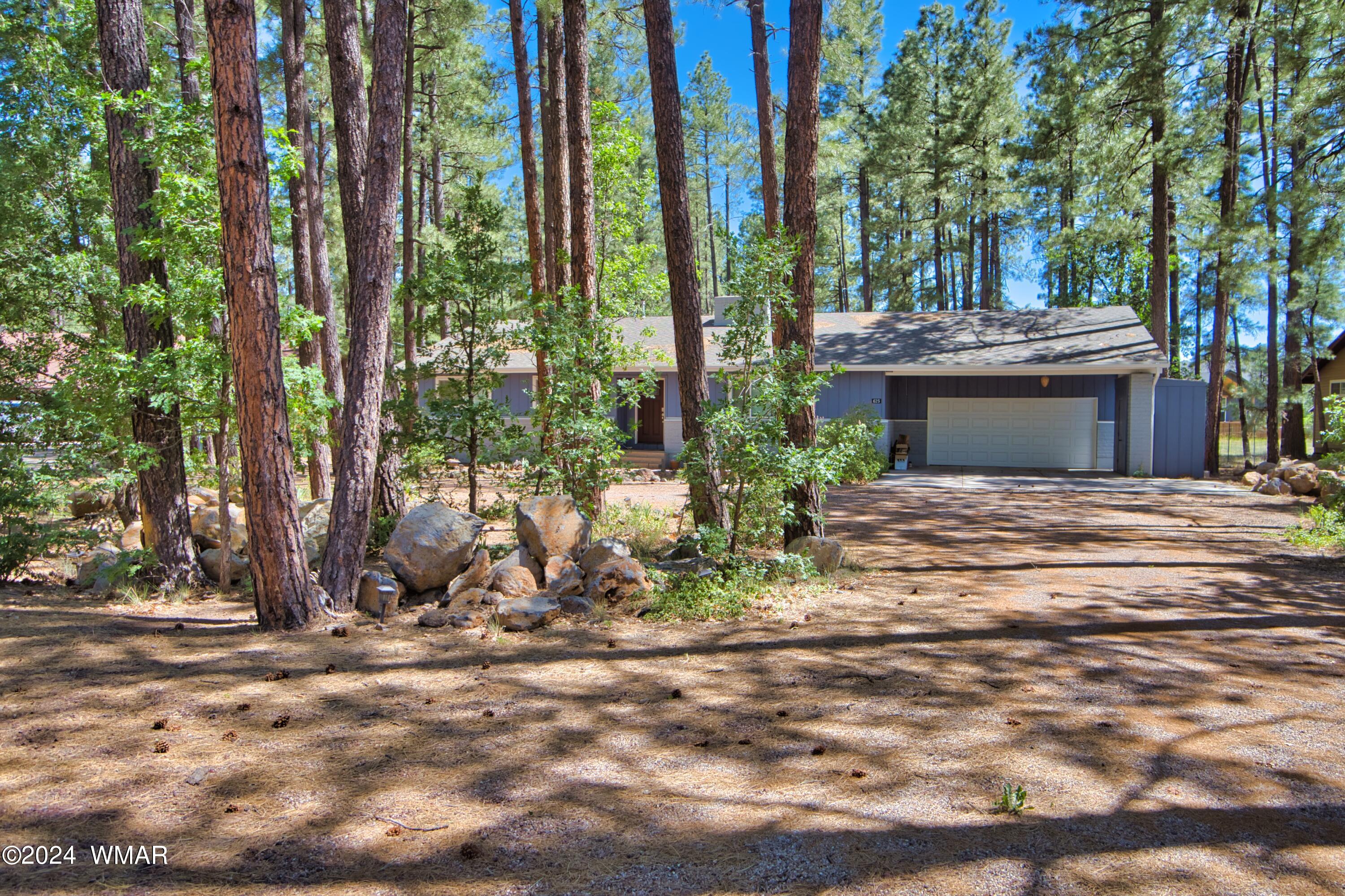 625 East Nora Place Pinetop, AZ 85935 - Photo 7 of 35 a view of a house with backyard and trees