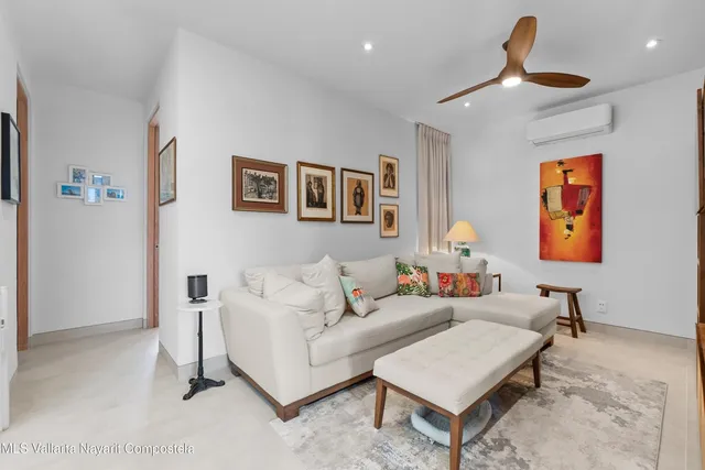 a living room with furniture and a window