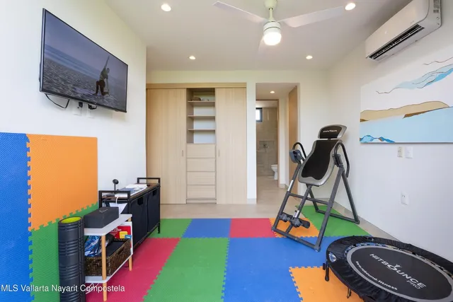 a room with furniture and a flat screen tv
