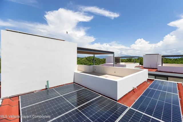a view of a living room and entryway