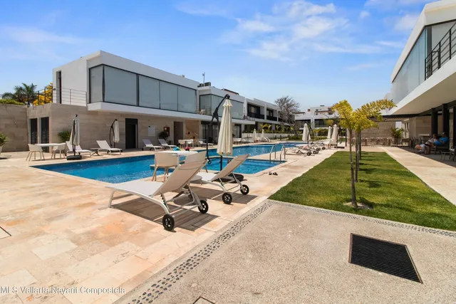 a view of a patio with swimming pool
