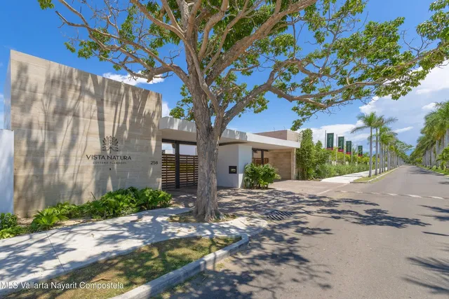 a wooden bench sitting in front of a building