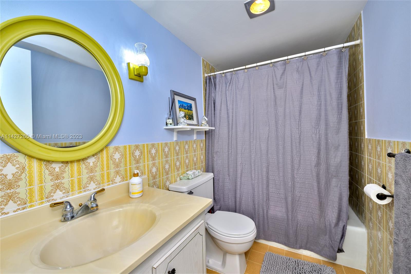 1231 Northwest 13th Street, Unit 472F Boca Raton, FL 33486 - Photo 14 of 22 a bathroom with a sink and a mirror