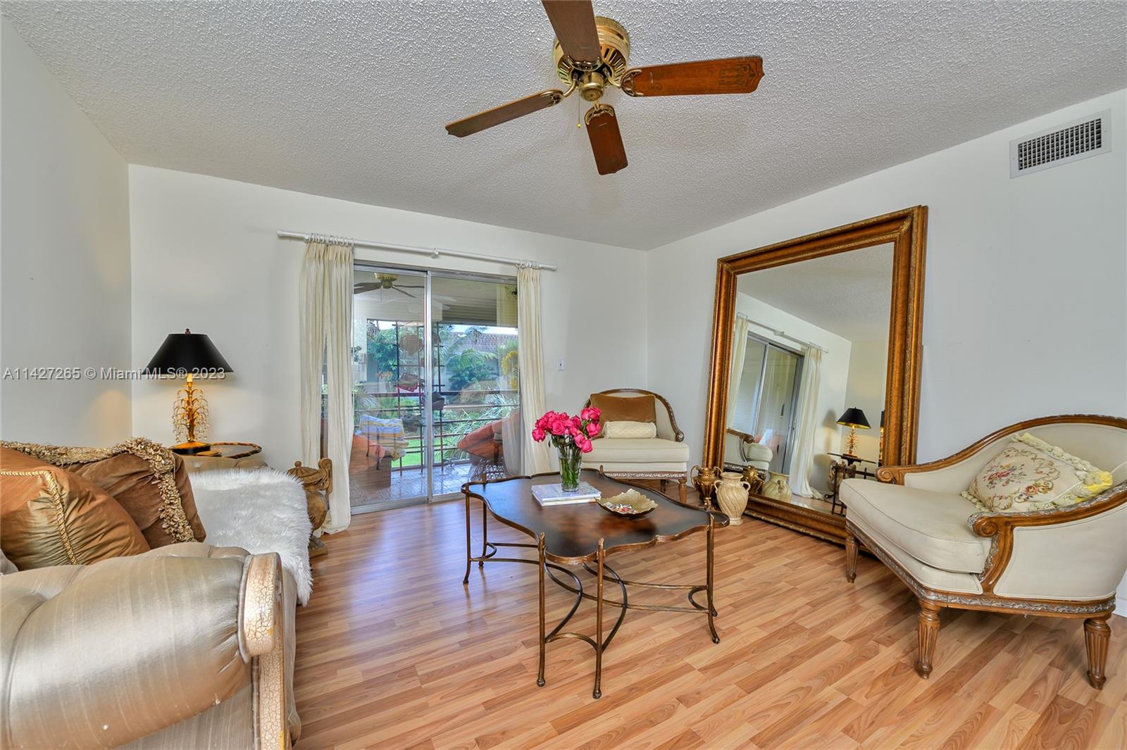 1231 Northwest 13th Street, Unit 472F Boca Raton, FL 33486 - Photo 15 of 22 a living room with furniture and a wooden floor