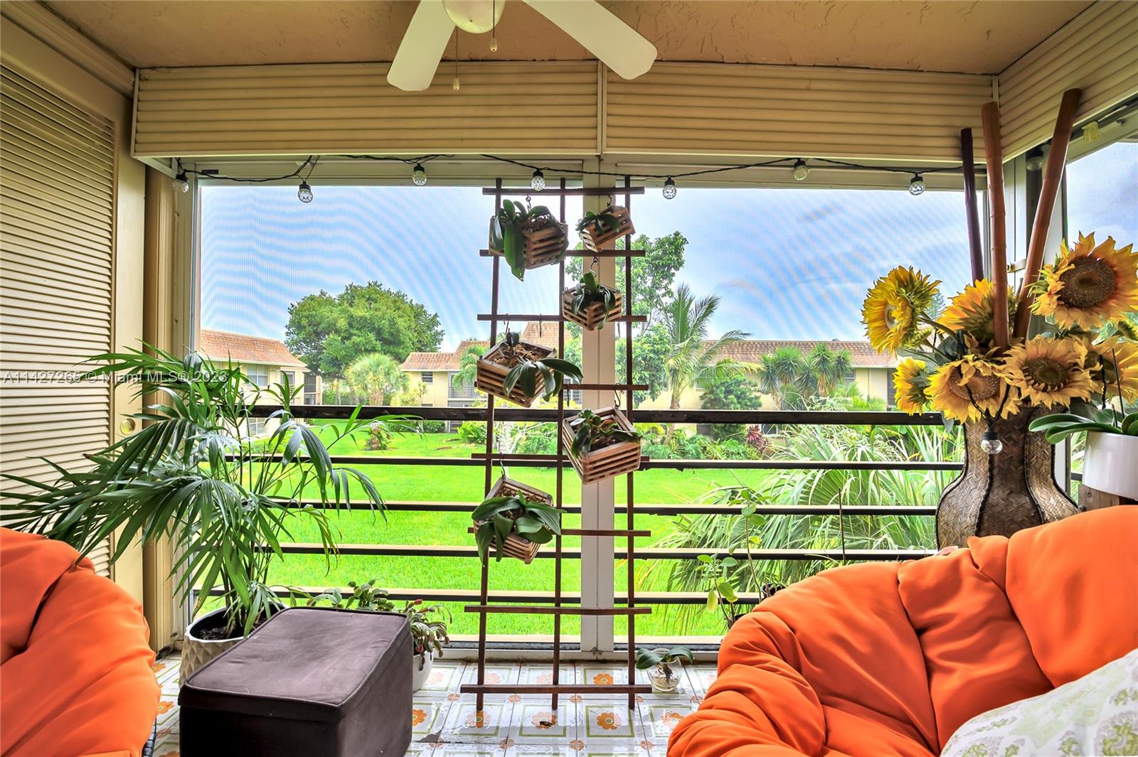 1231 Northwest 13th Street, Unit 472F Boca Raton, FL 33486 - Photo 16 of 22 a view of a porch with furniture and a potted plant
