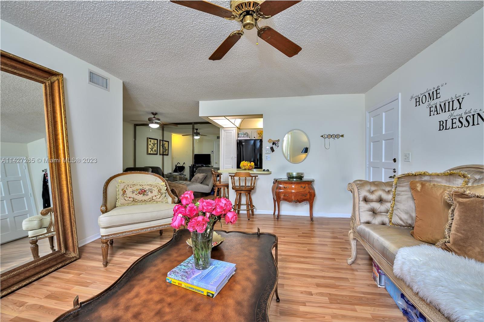 1231 Northwest 13th Street, Unit 472F Boca Raton, FL 33486 - Photo 2 of 22 a living room with furniture and dining table
