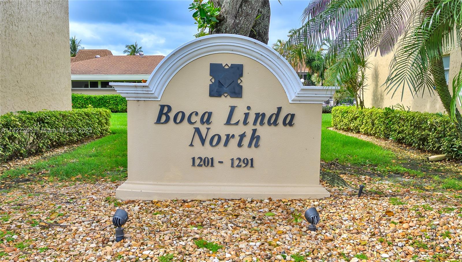 1231 Northwest 13th Street, Unit 472F Boca Raton, FL 33486 - Photo 3 of 22 a sign that is on the side of a road