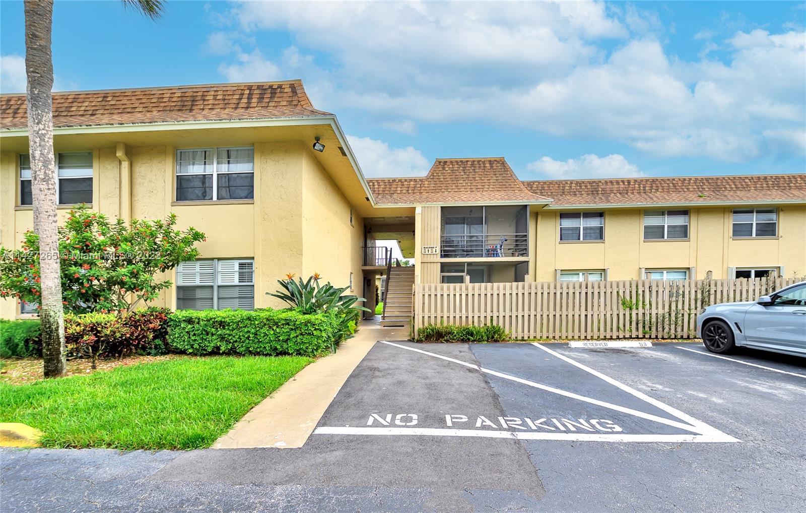 1231 Northwest 13th Street, Unit 472F Boca Raton, FL 33486 - Photo 5 of 22 a view of a house with a garden