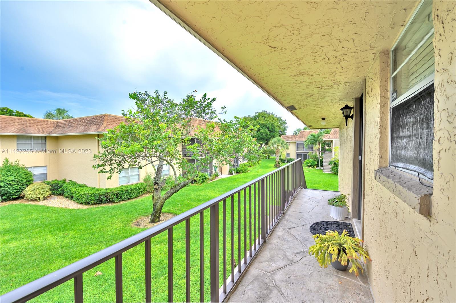 1231 Northwest 13th Street, Unit 472F Boca Raton, FL 33486 - Photo 6 of 22 a view of a garden