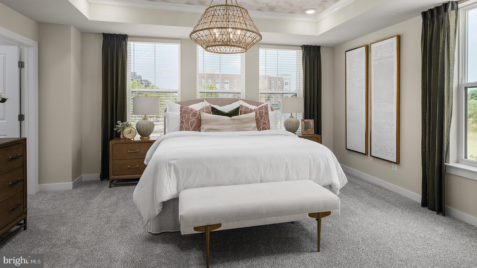 Tbb Cloongee Terrace, Unit ROSSLYN Sterling, VA 20166 - Photo 8 of 14 a bedroom with a bed and a chandelier