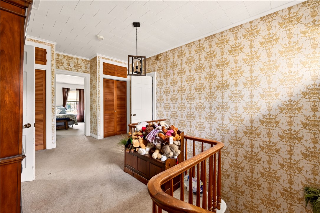 7780 Cold Springs Road Bath, NY 14810 - Photo 15 of 50 Ornate wall patterns and carpeted flooring define this classic upper-level landing space.
