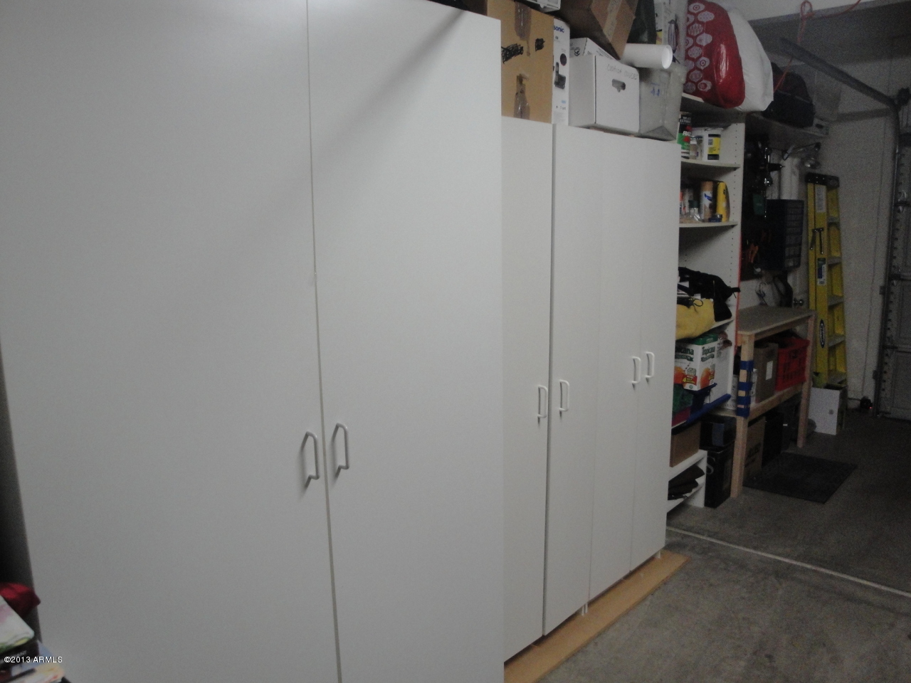 7710 East Gainey Ranch Road, Unit 124 Scottsdale, AZ 85258 - Photo 54 of 60 BUILT IN STORAGE IN GARAGE