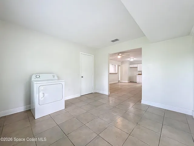 a view of hallway with cabinets
