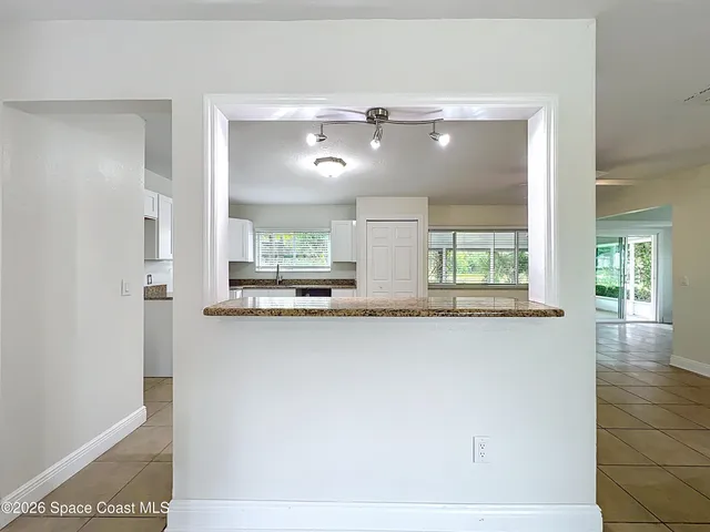 a view of a kitchen from the hallway