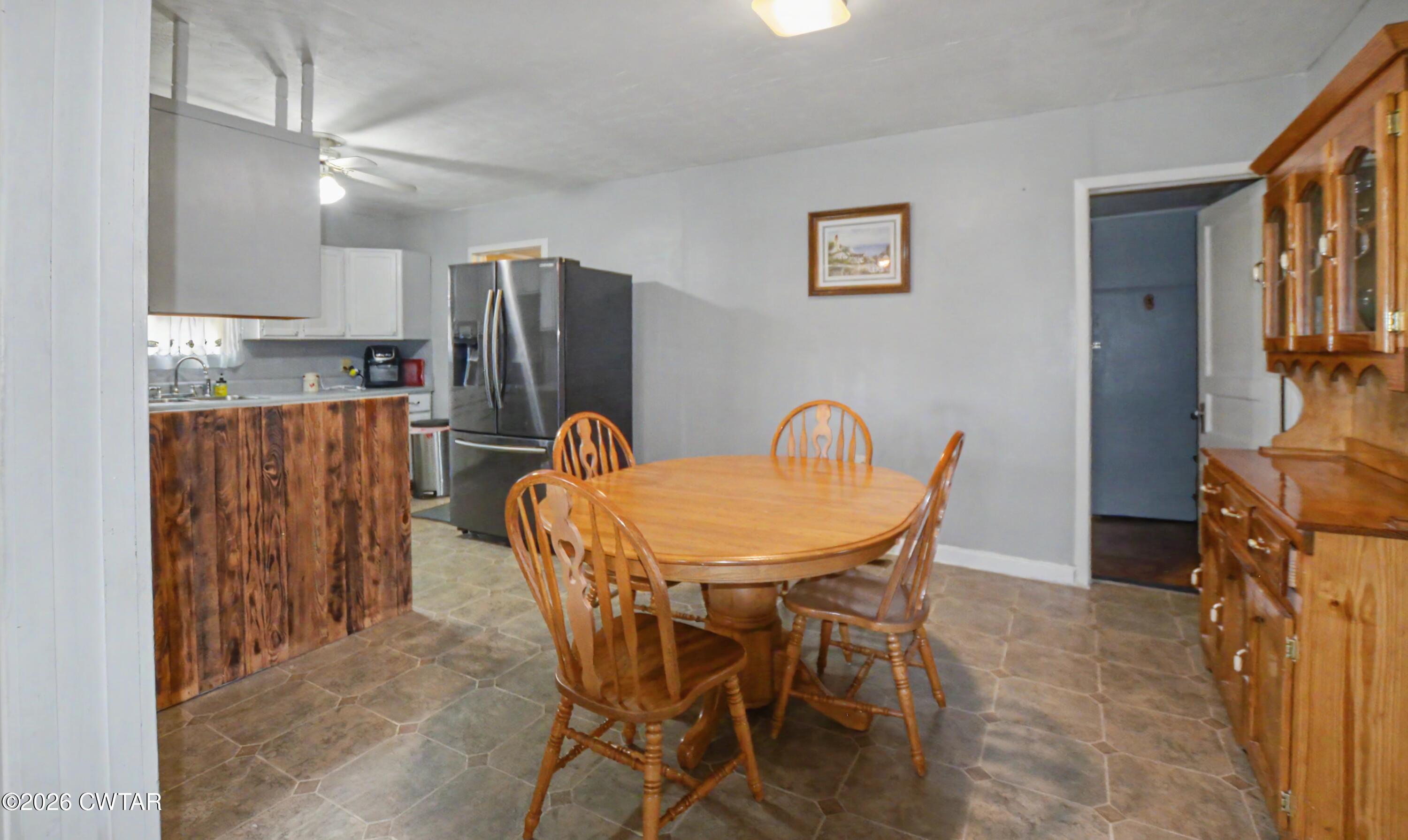 158 Depot Street Friendship, TN 38034 - Photo 11 of 16 a view of a dining room with furniture and a chandelier
