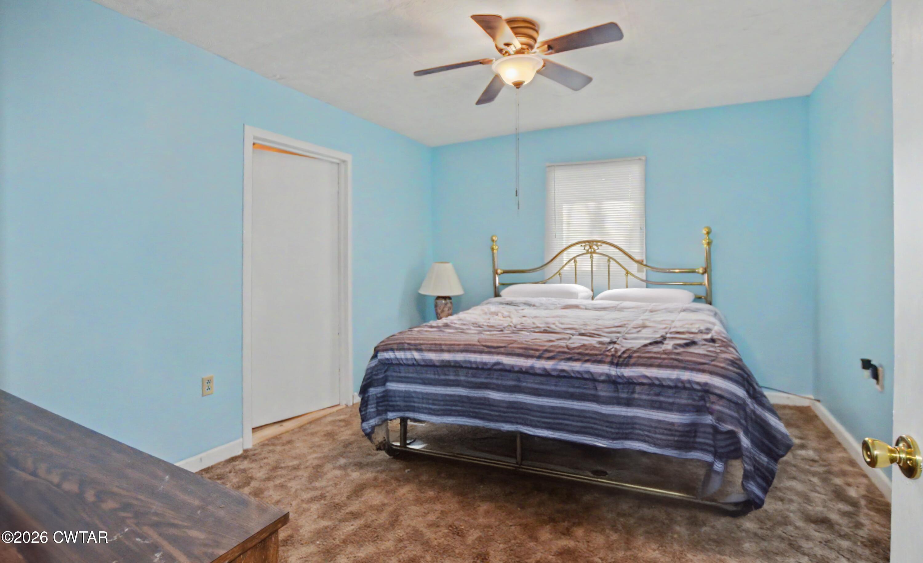 158 Depot Street Friendship, TN 38034 - Photo 12 of 16 a bedroom with a bed dresser and a window