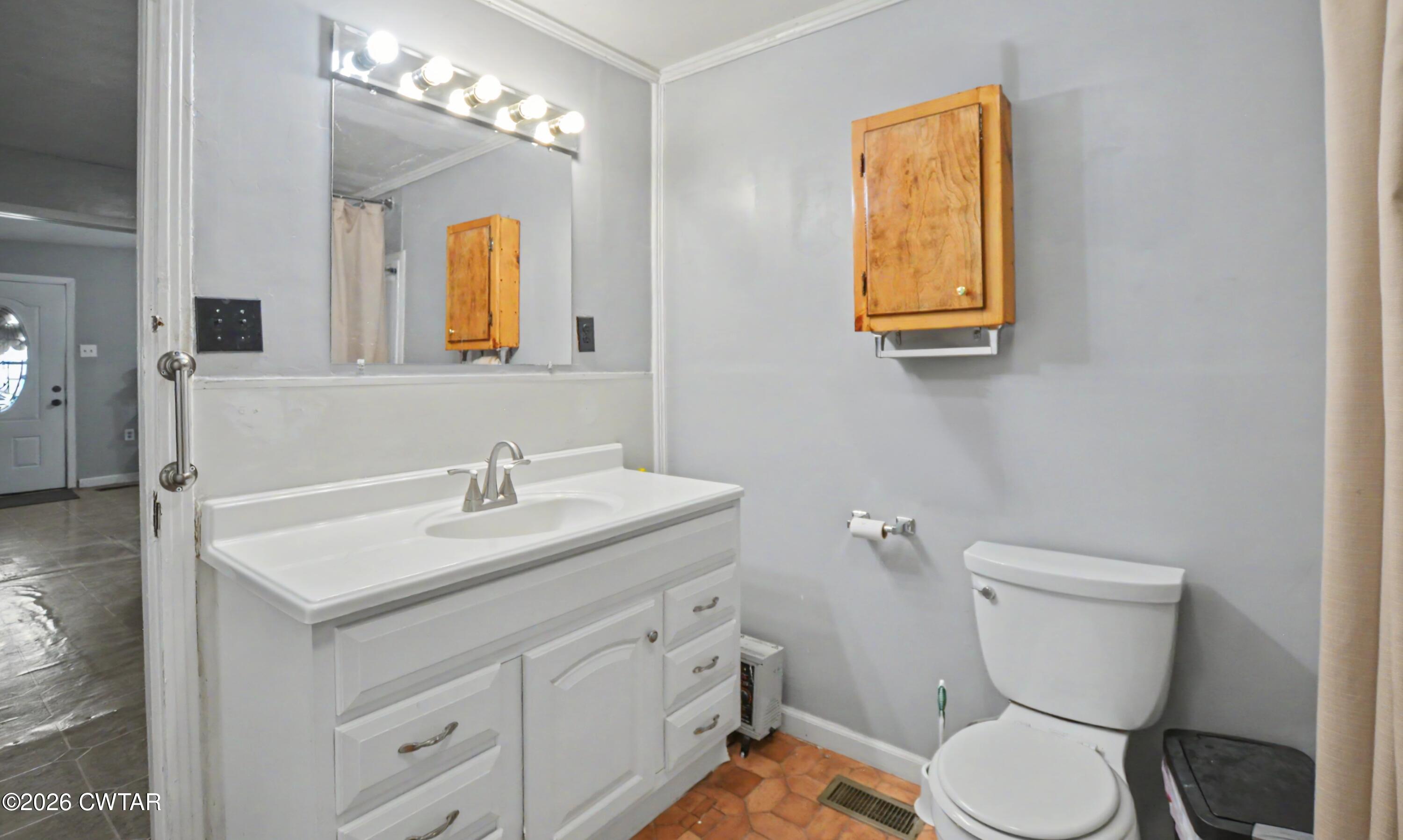 158 Depot Street Friendship, TN 38034 - Photo 15 of 16 a bathroom with a toilet sink and mirror