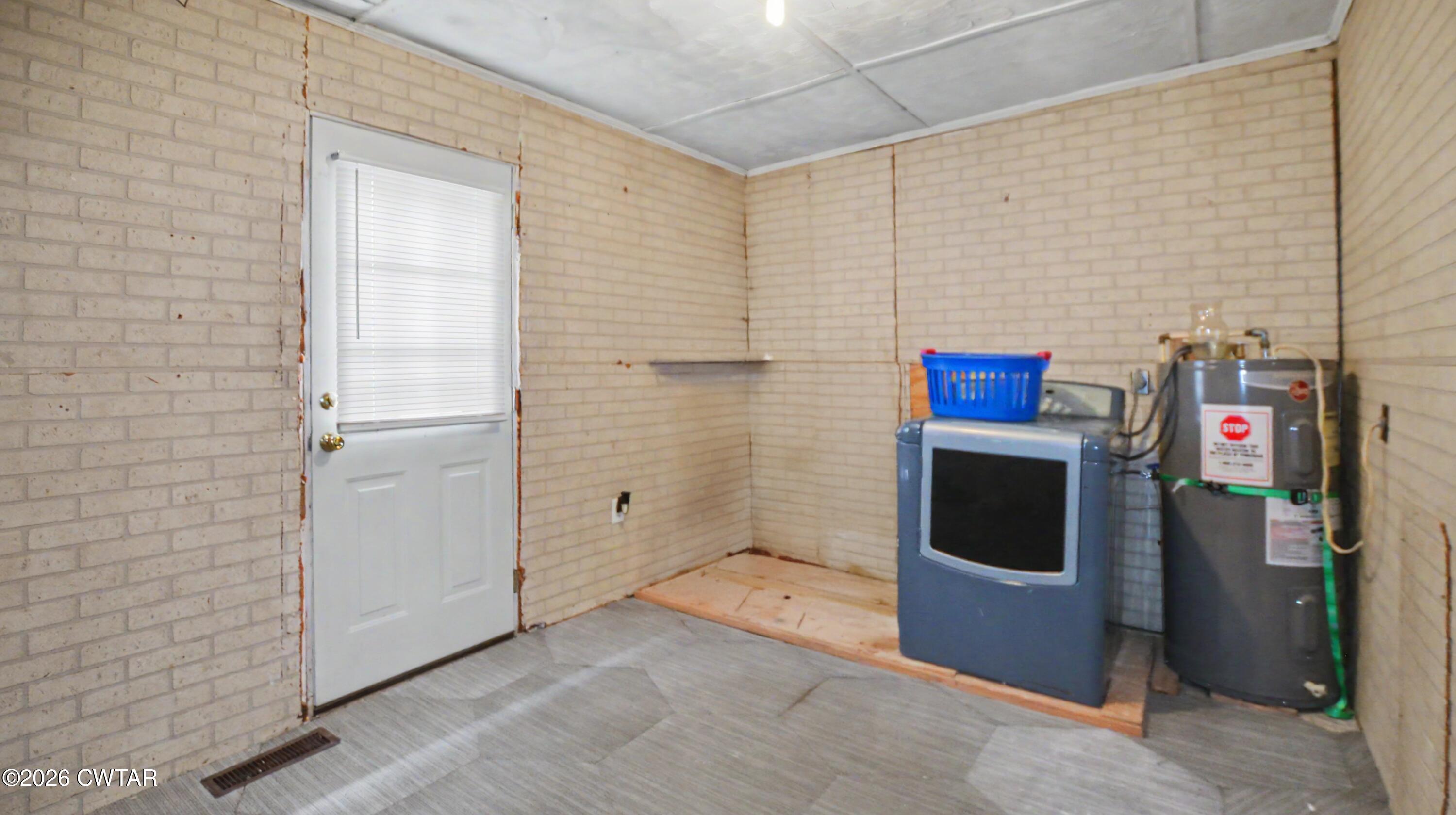 158 Depot Street Friendship, TN 38034 - Photo 16 of 16 a utility room with dryer and washer
