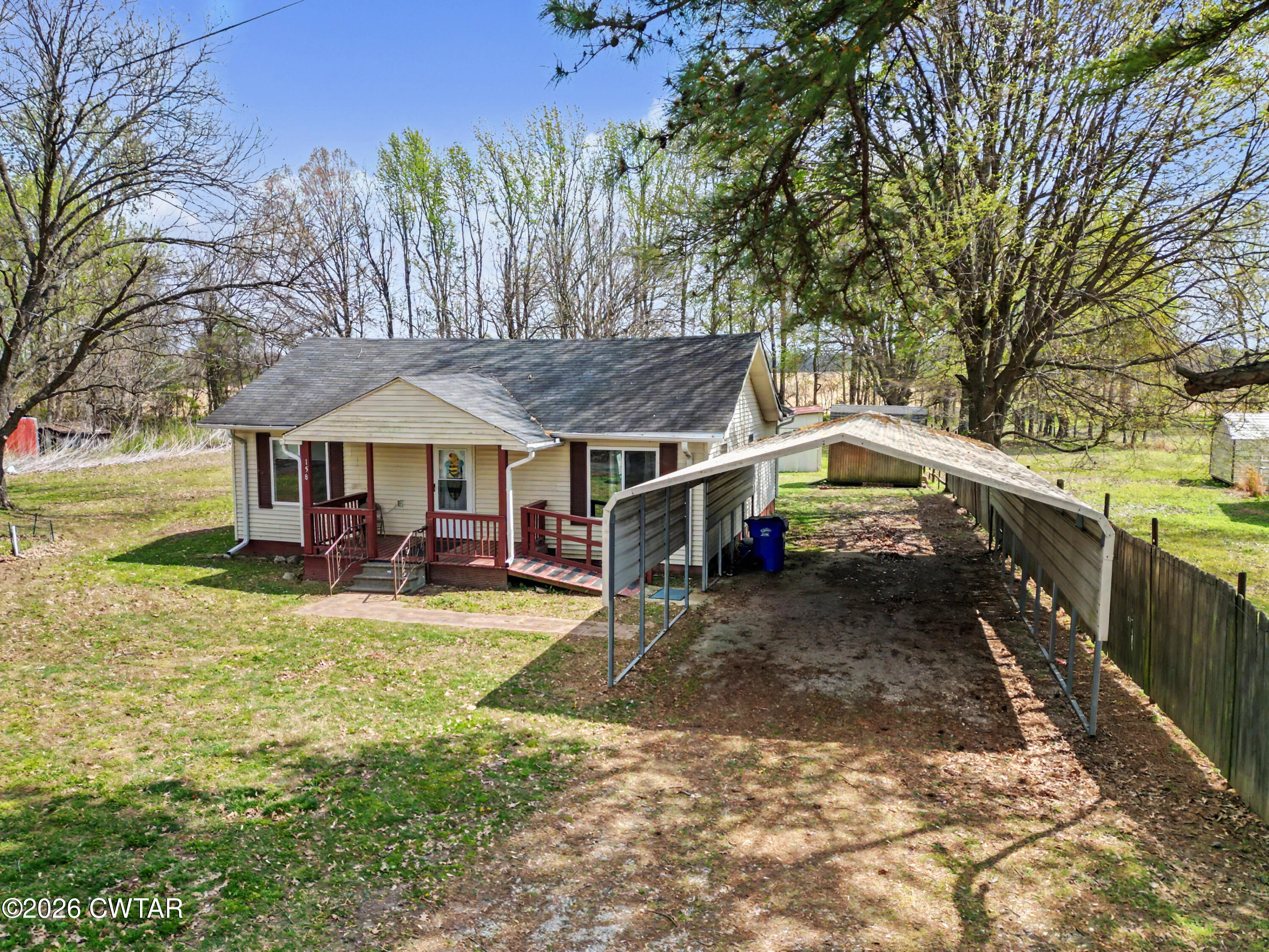 158 Depot Street Friendship, TN 38034 - Photo 3 of 16 a view of a house with backyard and sitting area