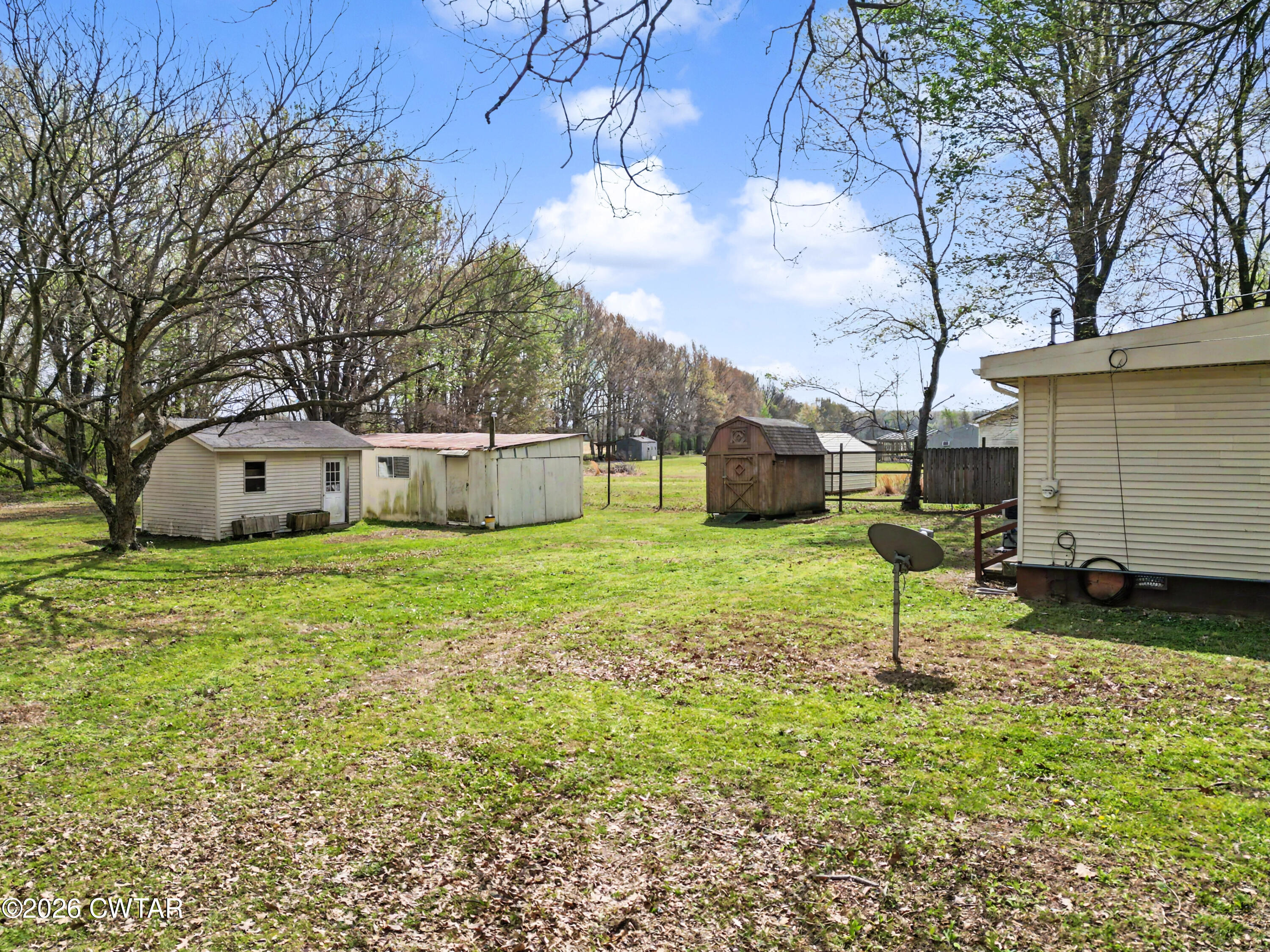 158 Depot Street Friendship, TN 38034 - Photo 4 of 16 a house view with a sitting space and garden