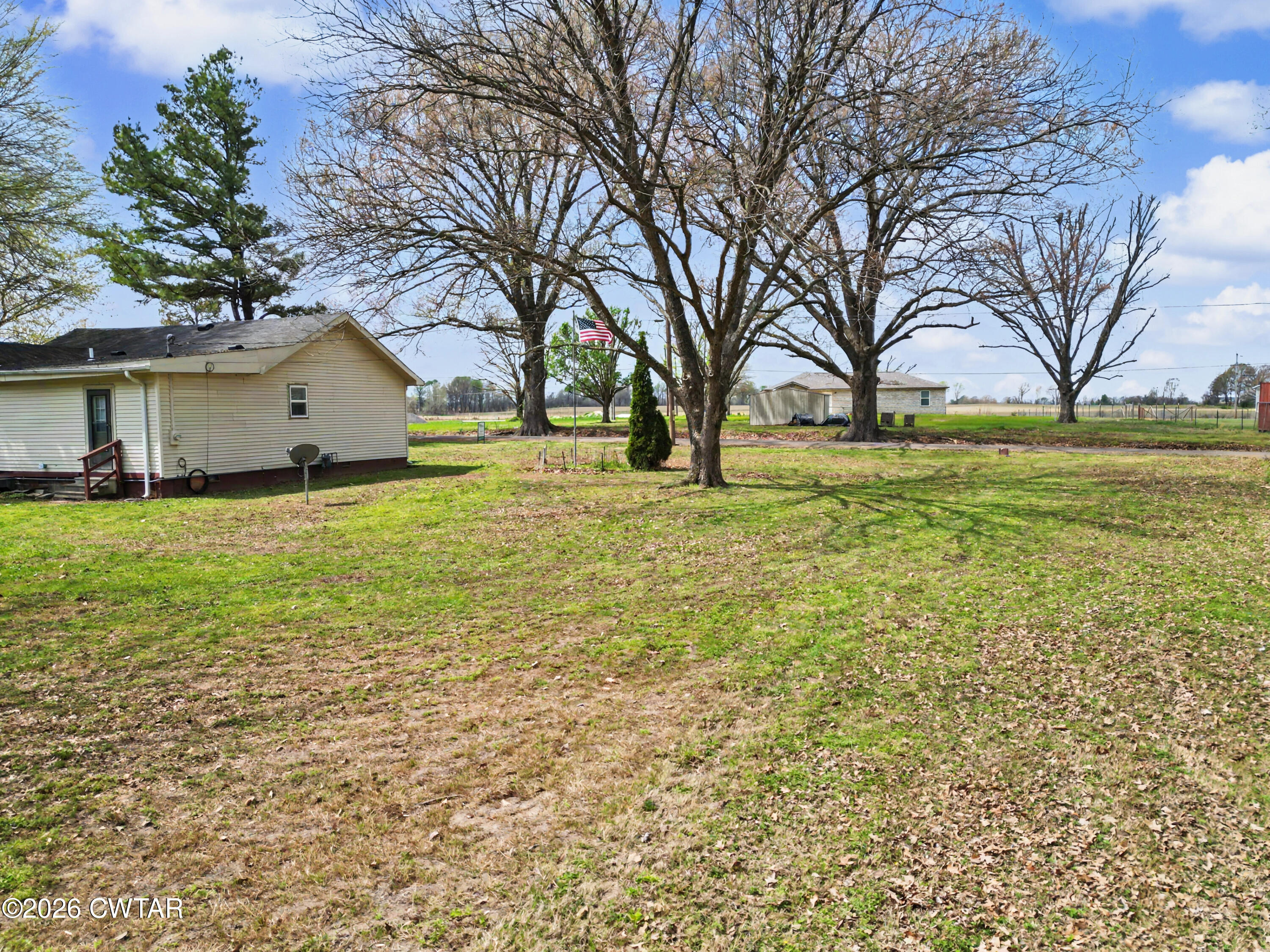 158 Depot Street Friendship, TN 38034 - Photo 6 of 16 a house view with swimming pool in front of it
